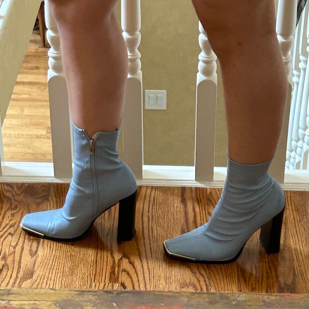 Fits as a size 7.5 women’s, sky blue boot with a black heel. Orig from ASOS.